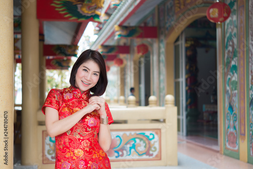 Portrait of beautiful asian woman in Cheongsam dress,Thailand people,Happy Chinese new year concept