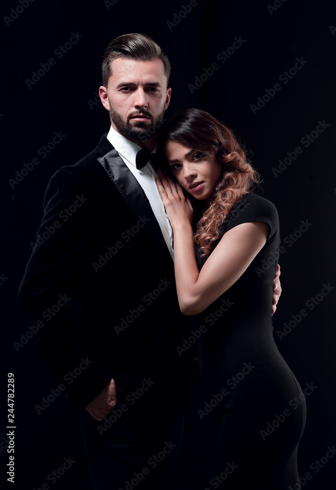 portrait of fashion couple on black background portrait of fashion couple on black background