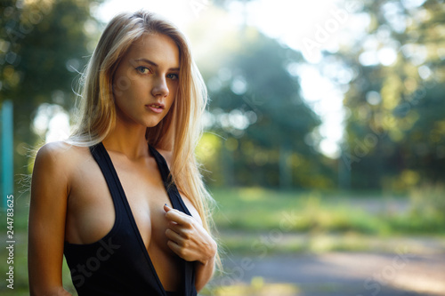 Canvas Print Hot blond russian girl posing at the park in sport style
