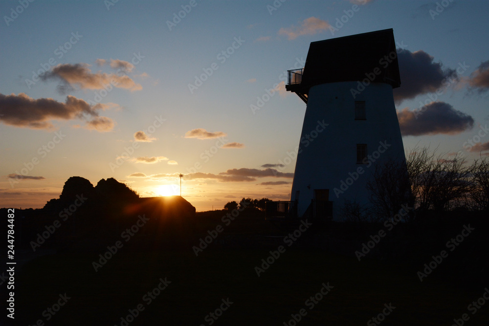 Sunset over Melyn Y Bont restored windmill near Rhosneigr on Anglesey