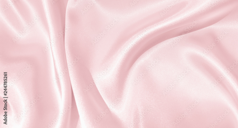 The texture of the satin fabric of pink color for the background The texture of the satin fabric of pink color for the background