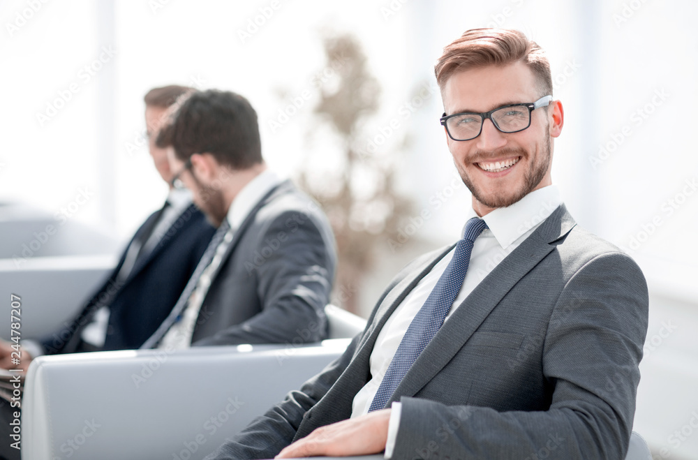 close up.happy businessman sitting in modern office close up.happy businessman sitting in modern office