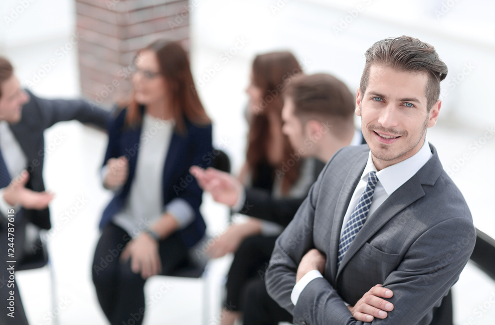 Happy young businessman in a business meeting Happy young businessman in a business meeting