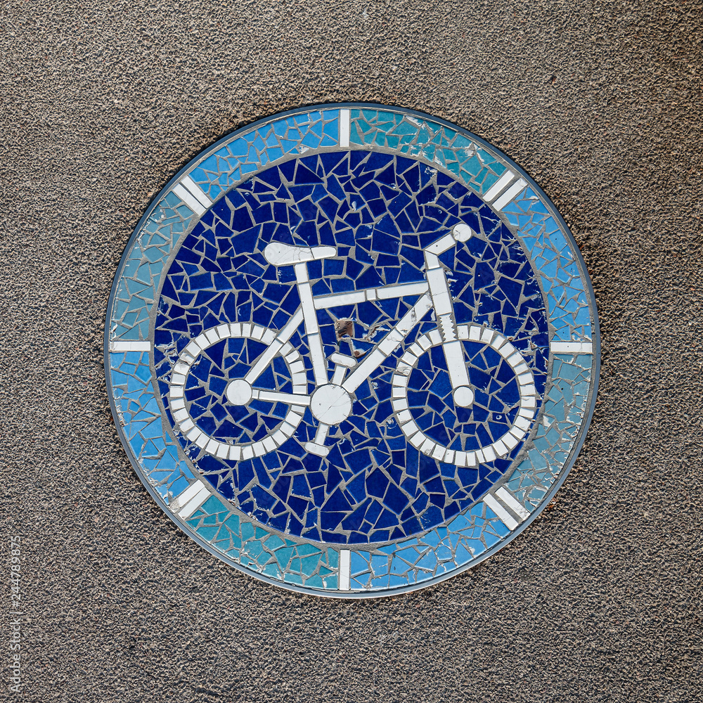 Mosaic in the Shape of Bike on a Bicycle Lane