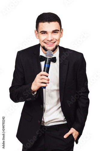 stylish elegant man in a black suit with a microphone in his hand