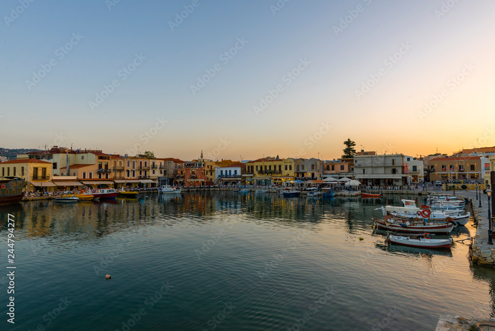 Greece, Crete Rethymno, panoramic view old venetian harbor at the sunset.