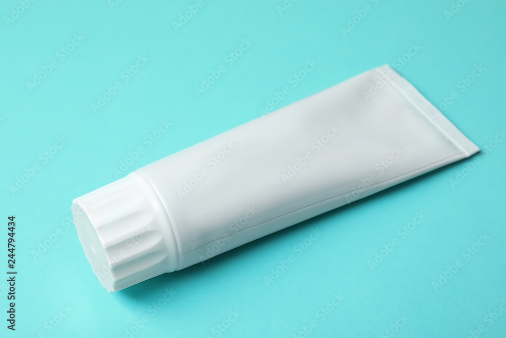 Blank tube of toothpaste on color background Blank tube of toothpaste on color background