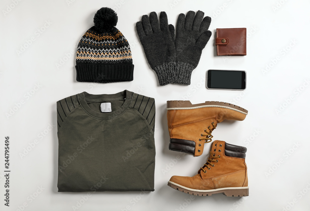 Flat lay composition with male winter clothes on white background - obrazy, fototapety, plakaty 