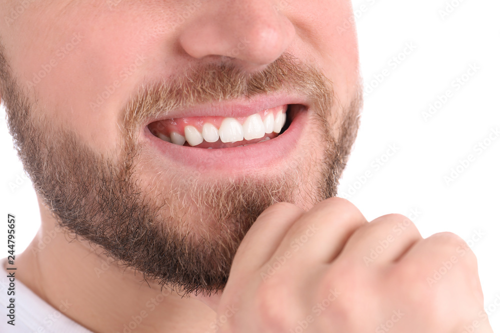 Young man with healthy teeth smiling on white background, closeup Young man with healthy teeth smiling on white background, closeup