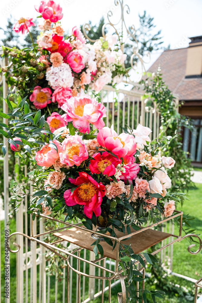 Fototapeta premium Chic peonies in the decoration of the wedding arch