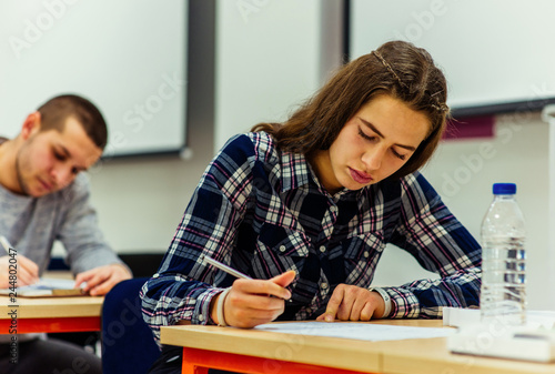 Smart students studying and learning taking notes