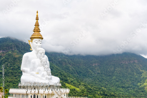 Buddha statue has large white five body on mountain surrounded by nature with cloud fog cover at Wat Phra That Pha Sorn Kaew Temple is a tourist attractions in Khao Kho, Phetchabun, Thailand