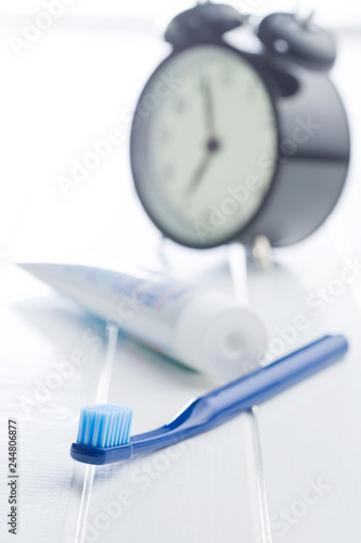 Colorful toothbrush and alarm clock.