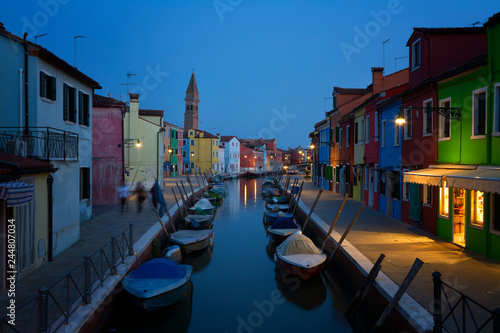 Old colorful houses and boats at night in Burano, Venice Italy. © Shchipkova Elena