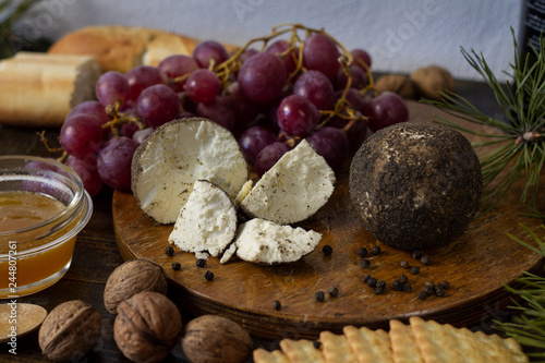 Сheese still life on wooden table
