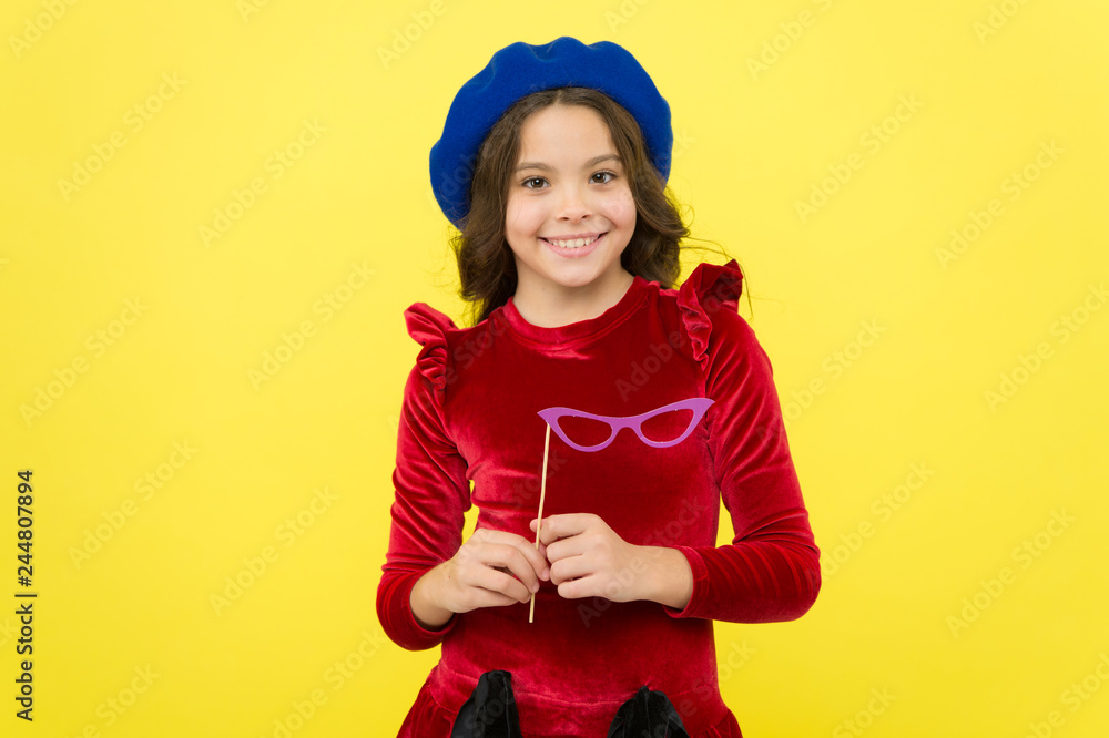 Party accessories concept. Child with long hair and fashionable hat. Birthday party photo booth props. Kid girl cheerful posing with eyeglasses party attribute. Lets have fun. She ready start party Party accessories concept. Child with long hair and fashionable hat. Birthday party photo booth props. Kid girl cheerful posing with eyeglasses party attribute. Lets have fun. She ready start party