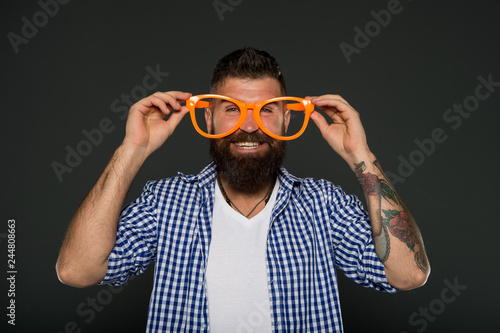 Man brutal bearded hipster wear funny eyeglasses accessory. Human strengths and virtues. Positive mood. Positive psychology. Overcome life troubles with smile. Happiness and positive. Stay positive