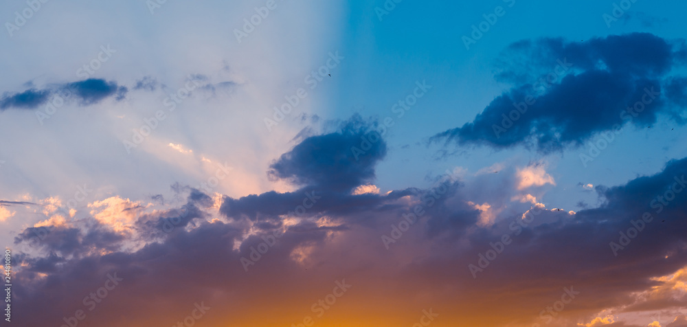 Obraz premium Landscape with dramatic light - beautiful golden sunset with saturated sky and clouds.