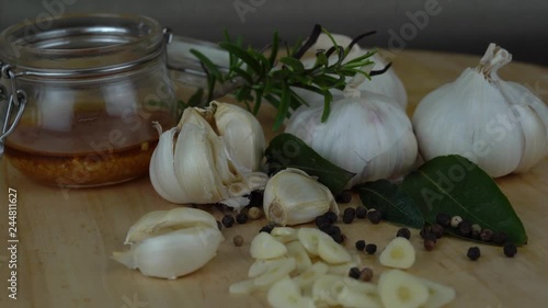 Close-Up Of Garlic with fresh rosemary and pepper. photo