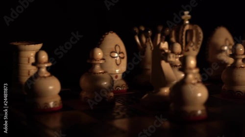 Even closer scene of a chess game with horizontal movement and stopping the black rulers. photo