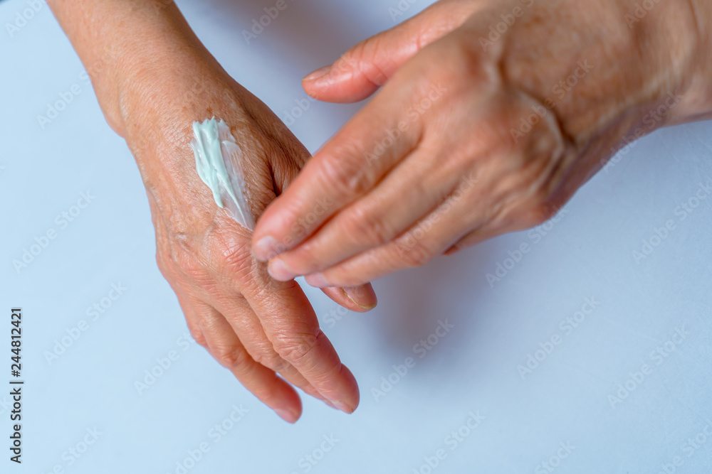 Skin care. Elderly woman applies Cream On Her Hands. Beauty produc. Skin care. Elderly woman applies Cream On Her Hands. Beauty produc.