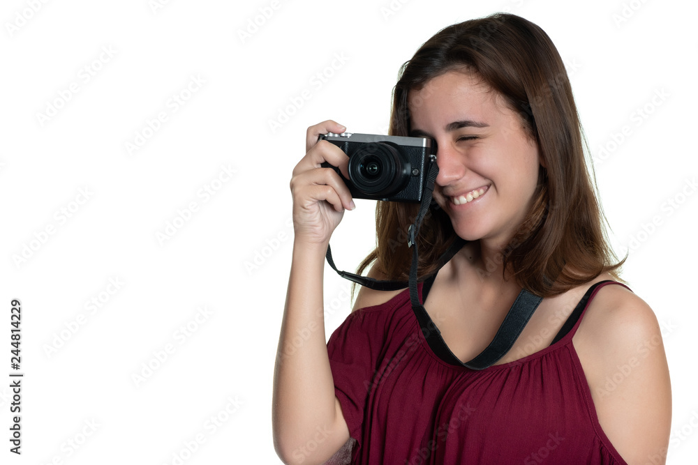 Teenage girl taking a photograph with a modern digital camera Teenage girl taking a photograph with a modern digital camera
