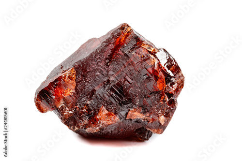 Macro mineral stone Garnet Spessartine on a white background