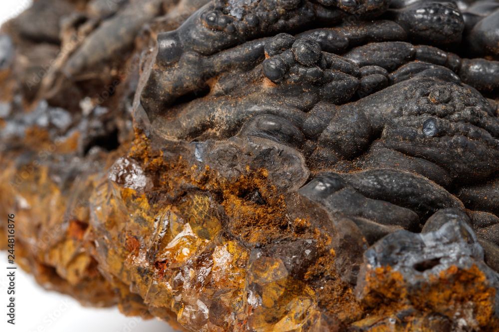 Macro mineral Hematite stone on a white background close-up Macro mineral Hematite stone on a white background close-up