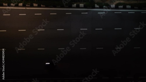 Top View of Passing Vehicles at Night photo