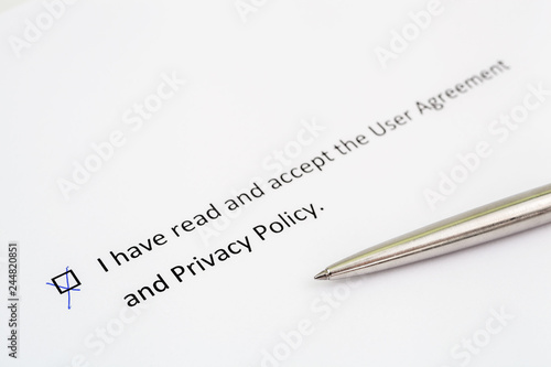 I have read and accept to the Terms of Use and Privacy Policy - checkbox with a check mark on white paper with pen. Checklist concept