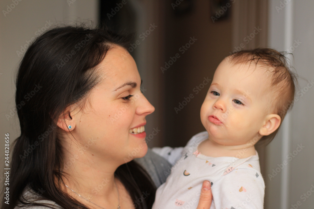 smiling beautiful mother with her baby smiling beautiful mother with her baby