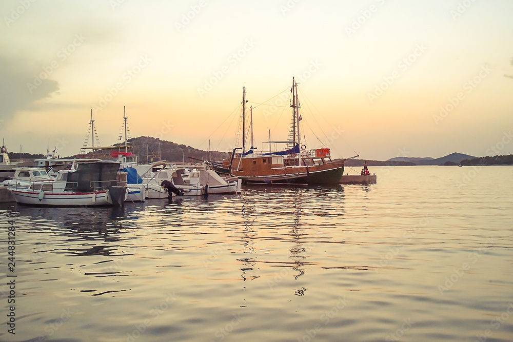 Beautiful boats in the harbor at sunset