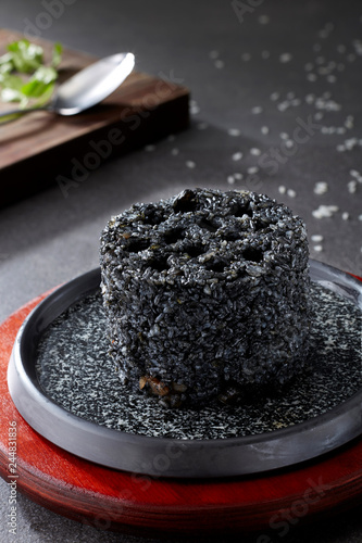Black fried rice in the shape of honeycomb briquette

