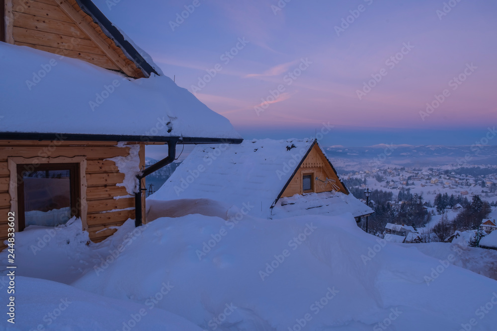 The snow covered wooden village. The snow covered wooden village.