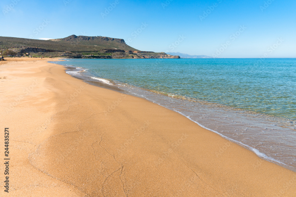 Panoramic view of long sand beach at Arina Sand coast Heraklion Crete Greece. Turquoise water, blue sky mediterranean tropical destination.  Travel holiday concept.