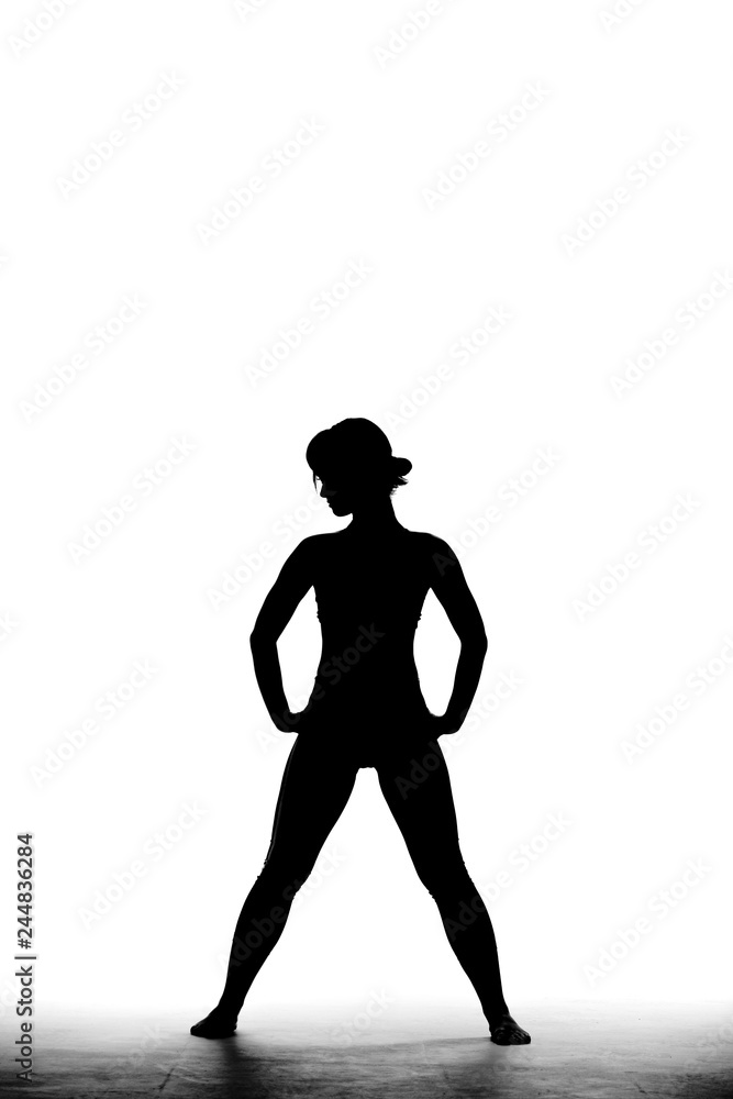 full body silhouette shot of a beautiful girl standing and posing