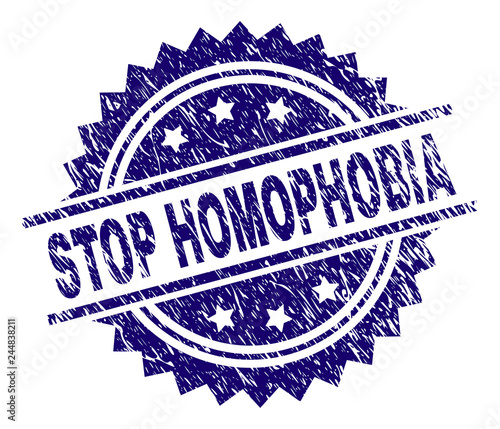STOP HOMOPHOBIA stamp seal watermark with distress style. Blue vector rubber print of STOP HOMOPHOBIA caption with dust texture.