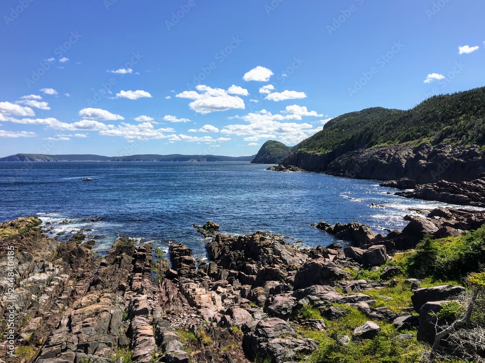 A view of the rocky shoreline along the east coast trail with the vast Atlantic while hiking outside of St. John’s, Newfoundland and Labrador, Canada. A view of the rocky shoreline along the east coast trail with the vast Atlantic while hiking outside of St. John’s, Newfoundland and Labrador, Canada.