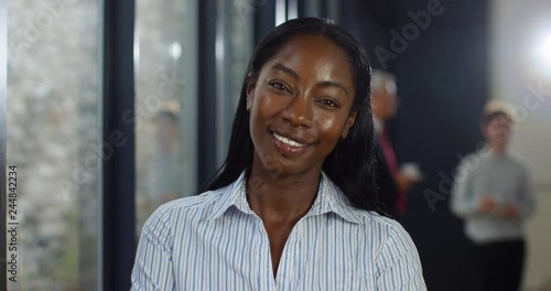 4K Happy young businesswoman listening & nodding to a colleague speaking at business event, seen from other person's point of view.