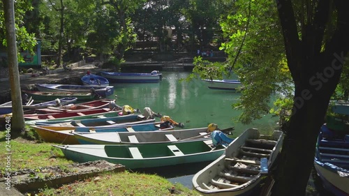 Lazy day on vacation, with traditional fishing boats docked at the port of Laguna Gri-Gri of Rio San Juan
(wide shot) photo