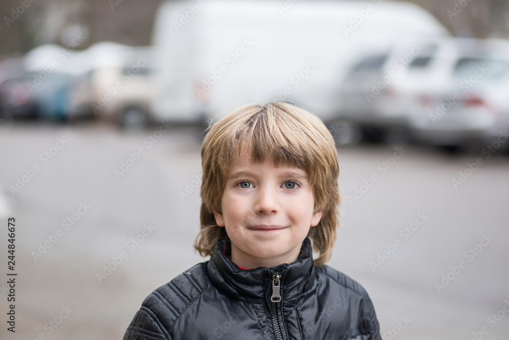 Portrait of a smiling boy with a blurred background