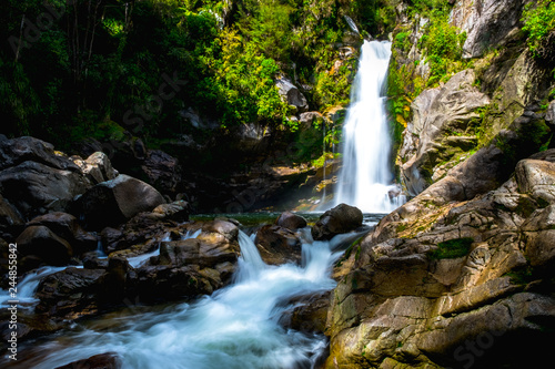 Beautiful waterfalls in the green nature, Wainui Falls, Abel Tasman, New Zealand. © Klanarong Chitmung