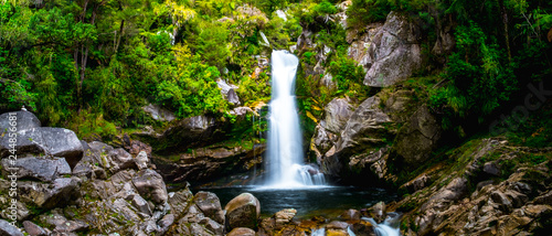 Fototapeta Naklejka Na Ścianę i Meble -  Beautiful waterfalls in the green nature, Wainui Falls, Abel Tasman, New Zealand.