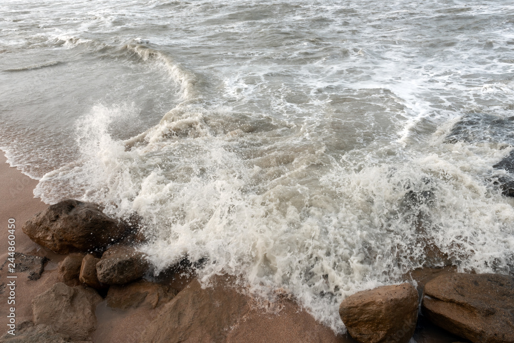 Stormy sea, the waves break on the rocks Stormy sea, the waves break on the rocks