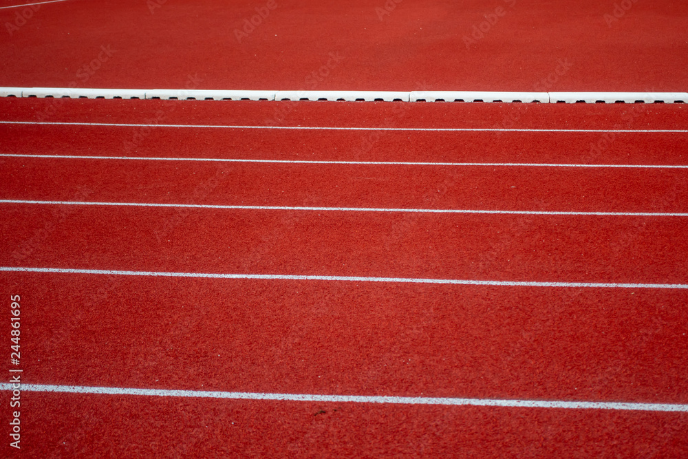 Red running track in stadium