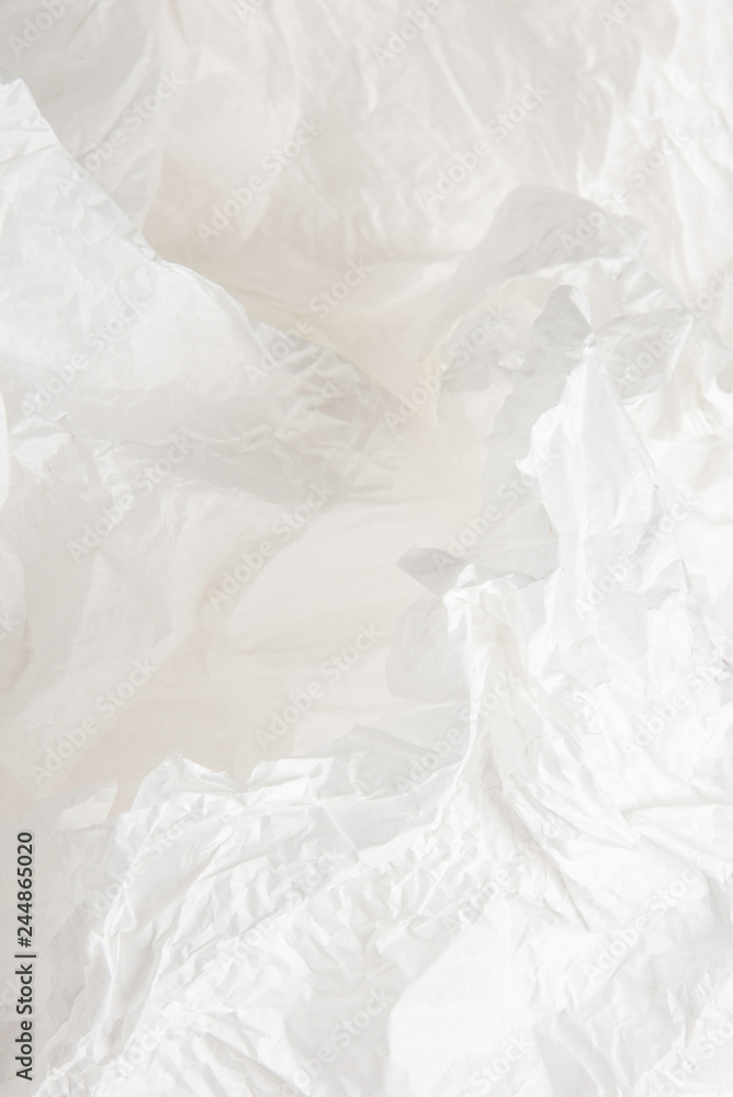 Obraz premium A crumpled piece of recyclable and biodegradable white tissue packaging paper.