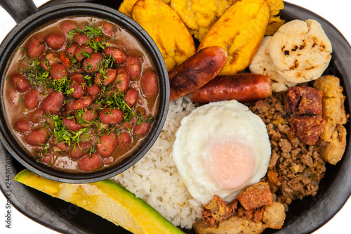 Traditional Colombian dish called Banda paisa: a plate typical of Medellin that includes meat, beans, egg and plantain photo