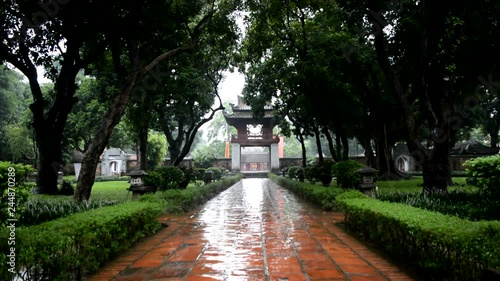 Vietnamese temple entrance while raining (Wide shot) photo