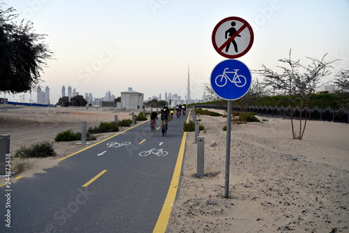 Photography Bikers at Dubai skyline from Nad Al Sheba bicycle track road, Dubai, United Arab