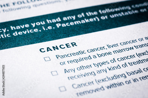 Close up cancer content on health insurance questionnaire.